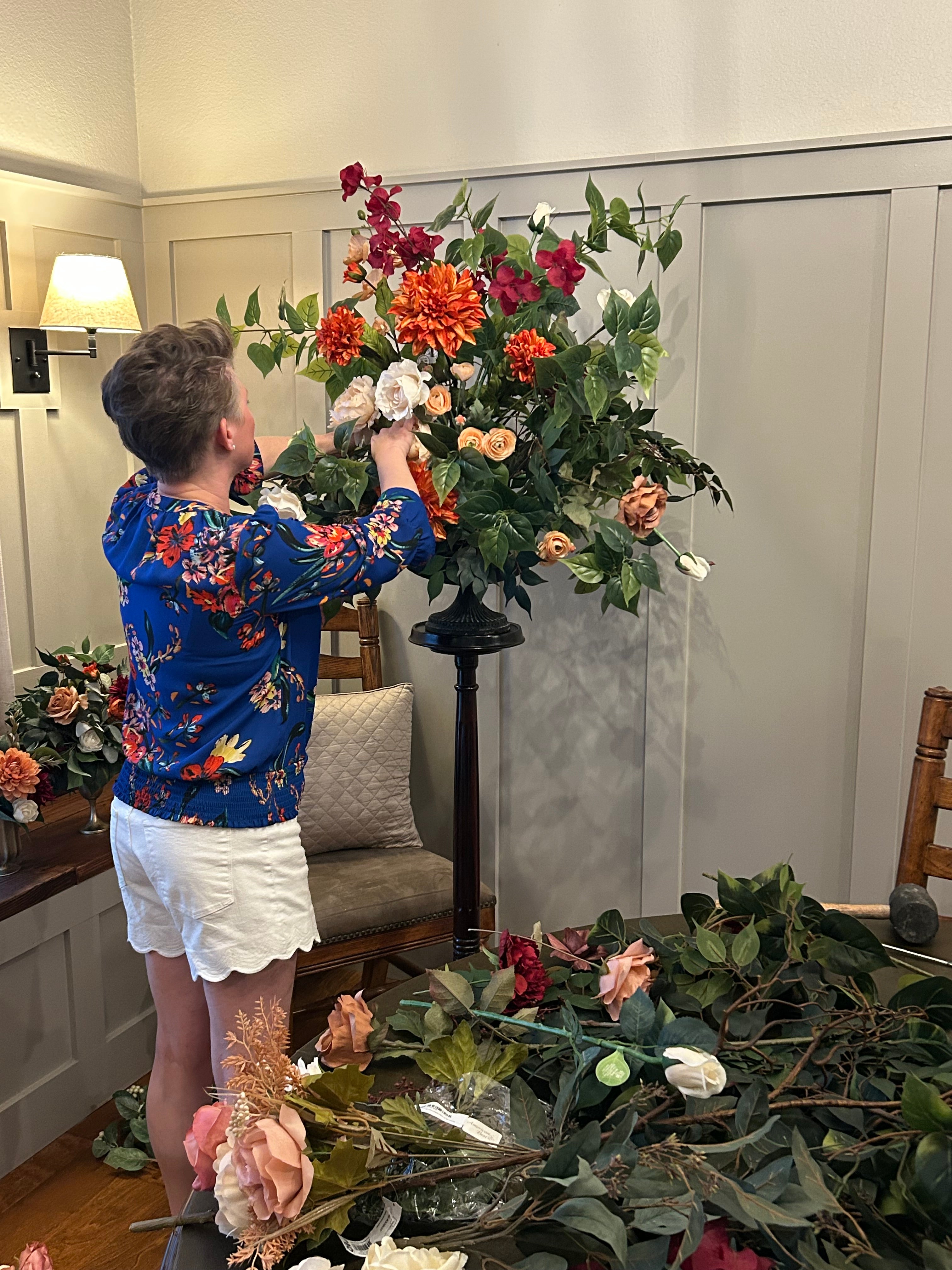 Melody Fuller creating a custom floral installation for a DFW wedding or event