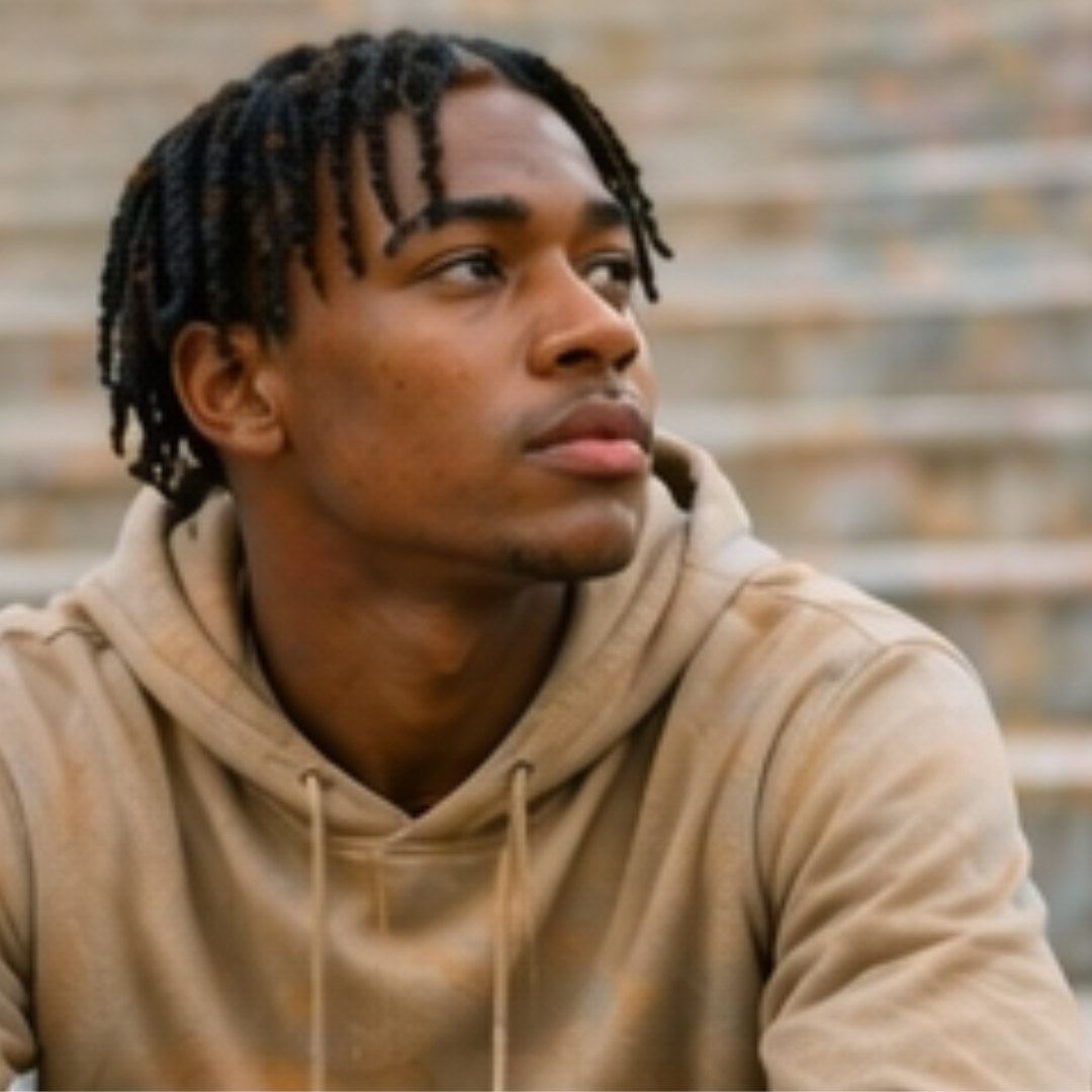 Teen boy looking away, illustration of emotional distance parents of teenage boys often feel